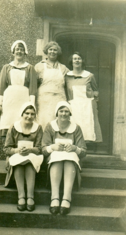 This undated photograph shows Miss E. Barr (centre back), a, cook for nine years in the 1930s. Housemaid Miss M Byrne is on her left. Seated on the left was Miss Ethel Massey (nee Wilson) who was also employed as a housemaid between 1930 and 1939. Does anyone recognise the other staff?