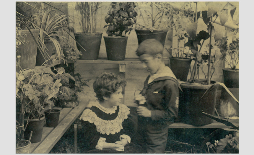 Edward and Dorothy Theomin in a greenhouse.