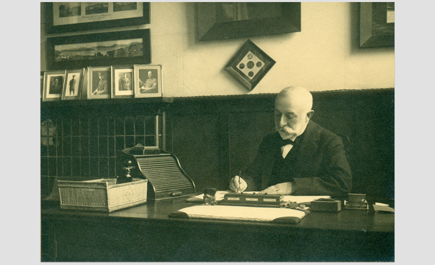 David Theomin sitting at his desk.